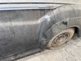a dirty car that is parked in the garage