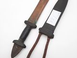 two old knives are sitting next to each other on a white surface