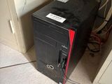 a computer that is sitting on the floor in the room