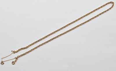 an image of a gold necklace with a chain on it