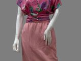 mannequin wearing a pink dress with flowers on it