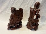 paire de figurines asiatiques en bois sculpté représentant un homme et une femme