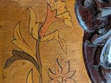 a close up of a mirror on a wooden table