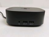 the back of a black device with two usb ports on a white surface