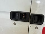 a white van that has a broken door handle on it
