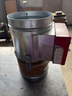 a large metal bucket sitting on top of a table