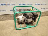 an image of a small pump in a green cage