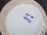 a close up of a plate with writing on it