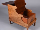 an old wooden box with a drawer on top of it