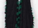 a black cape with green and white fur trim
