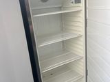 an image of an empty refrigerator in a kitchen
