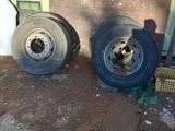 two tires sitting next to each other on the ground
