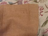 a piece of fabric on a couch with a flower pattern on it