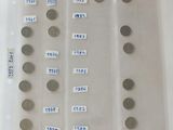 a lot of coins that are in a plastic container