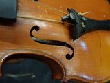 a close up of a violin that is being worked on
