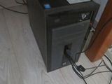 a computer that is sitting on the floor next to a wall