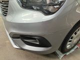 a close up of a car that has been painted silver