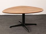 an image of a small wooden table with a black base