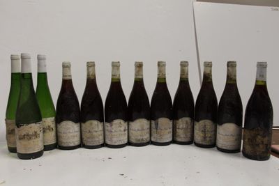 several bottles of wine are lined up in a row on a table