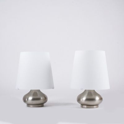 pair of silver table lamps with white lampshads on a white background