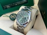 a rolex watch in a box with a watch on it