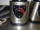 two blenders that are sitting on a counter