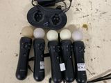 a lot of remote controls that are sitting on the floor