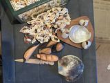 a table with shells and a tray of food on it