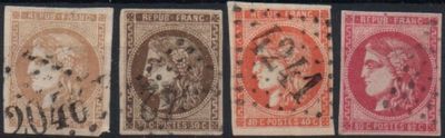a close up of a group of stamps on a black surface