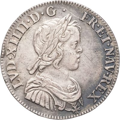 gros plan d'une pièce de monnaie sur laquelle figure une tête de femme