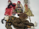 five dolls that are laying on the ground together