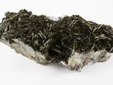 some kind of rock that is sitting on top of a white surface