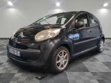 a picture of a small black car parked on a checkered floor
