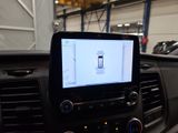 a car dashboard with a cell phone in the center
