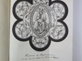 an open book with a drawing of a woman on it