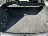 a trunk of a car with the back seats folded down
