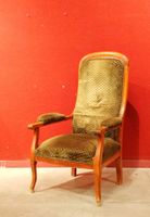 Fauteuil dit "Voltaire" en bois teinté.