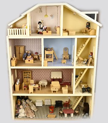a doll house with a lot of furniture inside of it