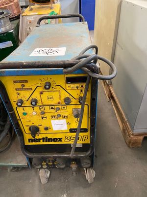a machine that is sitting on the ground in a warehouse