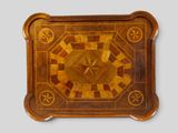 a wooden tray with a decorative design on it