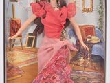 poupée Barbie dans une boîte, vêtue d'une robe rouge à passementerie dorée