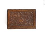 an old wooden box with a bird on it on a white surface