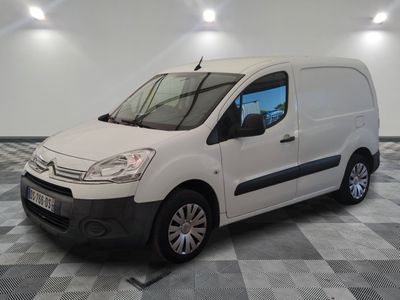 the white van is parked on a checkered floor in a room
