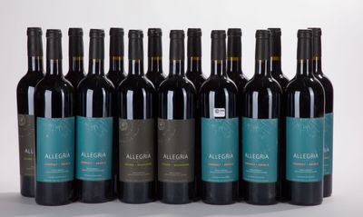 six bottles of red wine are lined up in a row