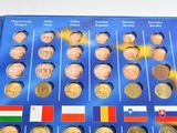a blue book with a bunch of different coins on it