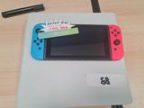 une Nintendo Switch Lite posée sur une table