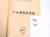 an open book with writing on it sitting on a table