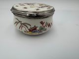 a small white box with a floral design on it