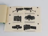 an open book with a picture of a camera on it