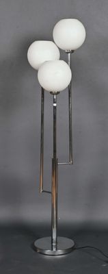 a close up of a lamp on a metal stand with three lamps